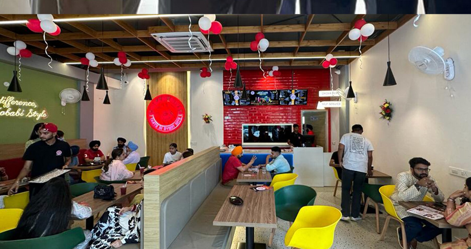 Guests seated inside a Kobabi Bites outlet